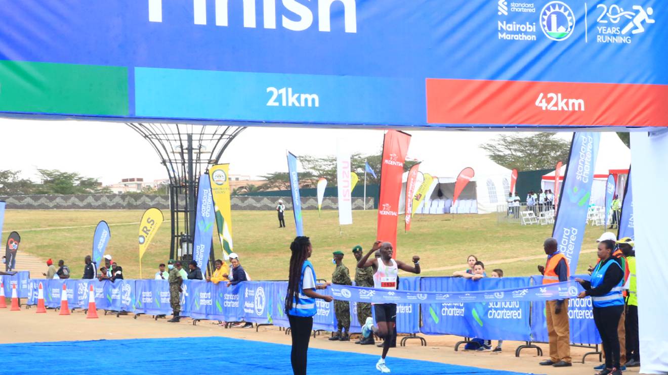 Alphonce Kigen crossing the finish line in the 42km race during the Nairobi Standard Chartered Marathon 2023. PHOTO/COURTESY